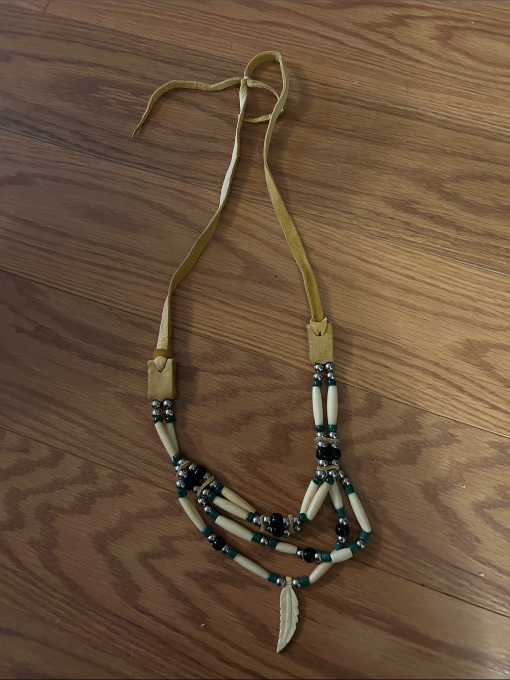 Boho Beaded Feather Necklace with tan leather